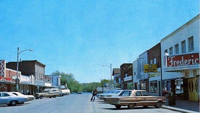 Frederic's Main Street with mid-century cars and storefronts